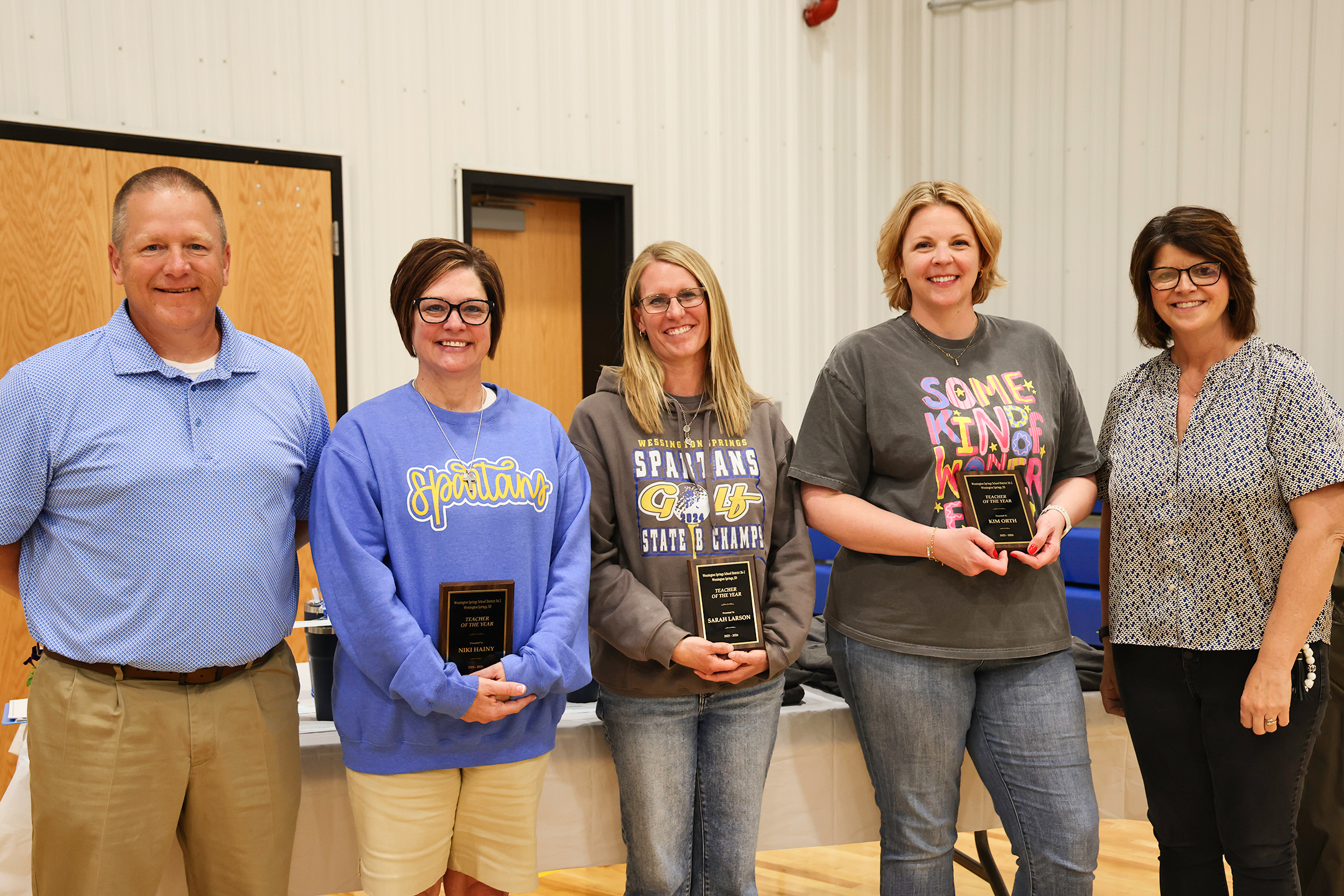 Wessington Springs School District Superintendent Jason Kolousek, left, and Wessington Springs Elementary Principal Becky Fjerstad, right, join Teachers of the Year recipients Niki Hainy, Kim Orth and Sarah Larson following the presentation of the district’s annual staff awards. The three elementary educators were recognized for their dedication to student success and their positive impact on the school community.