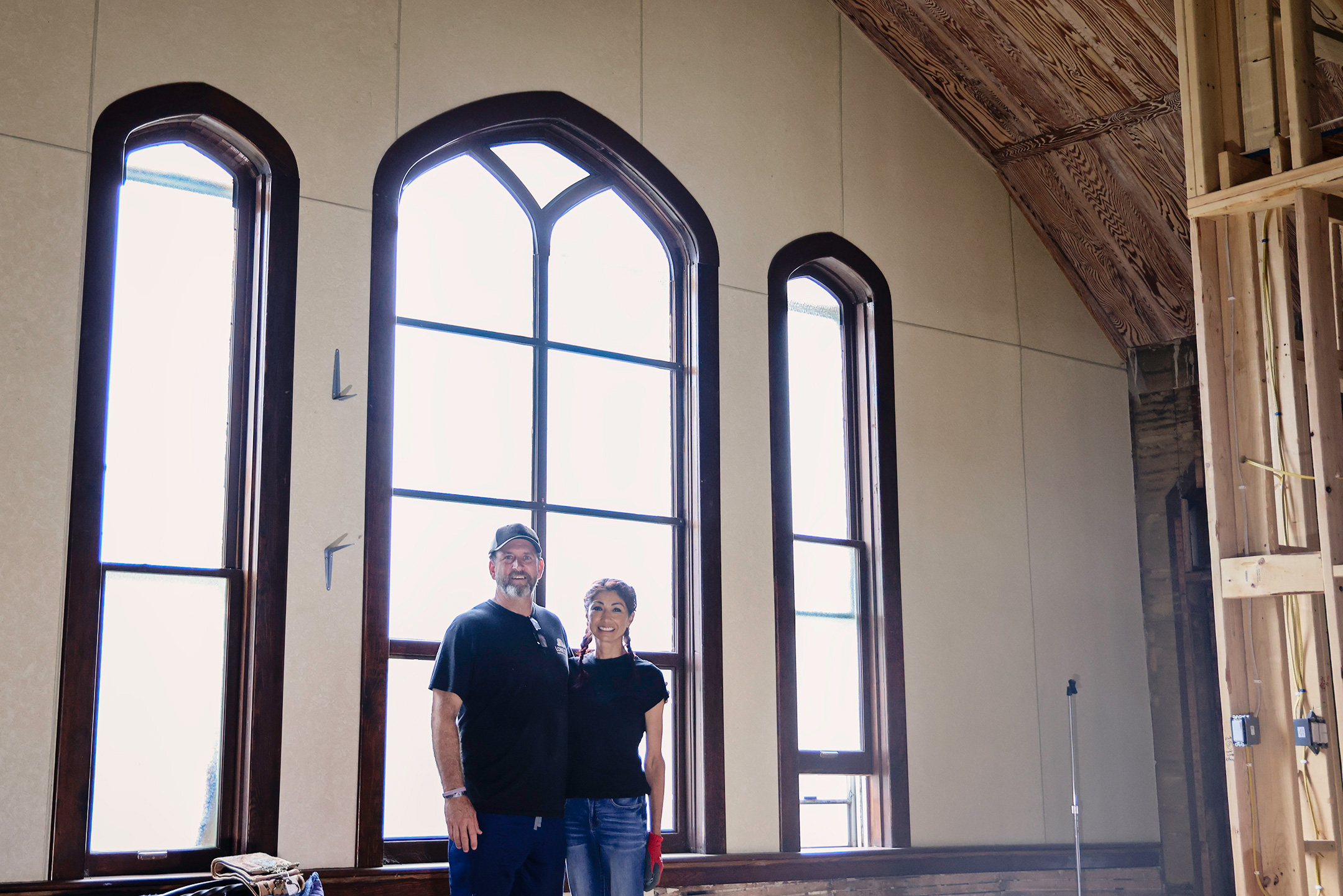 Jim and Carolyn Ferguson stand inside the former United Church of Christ in Wessington Springs, where they have spent the past several years transforming the historic church into their home. The large west-facing windows behind them will eventually be replaced with double doors, creating the home’s new main entrance and opening onto a covered deck.