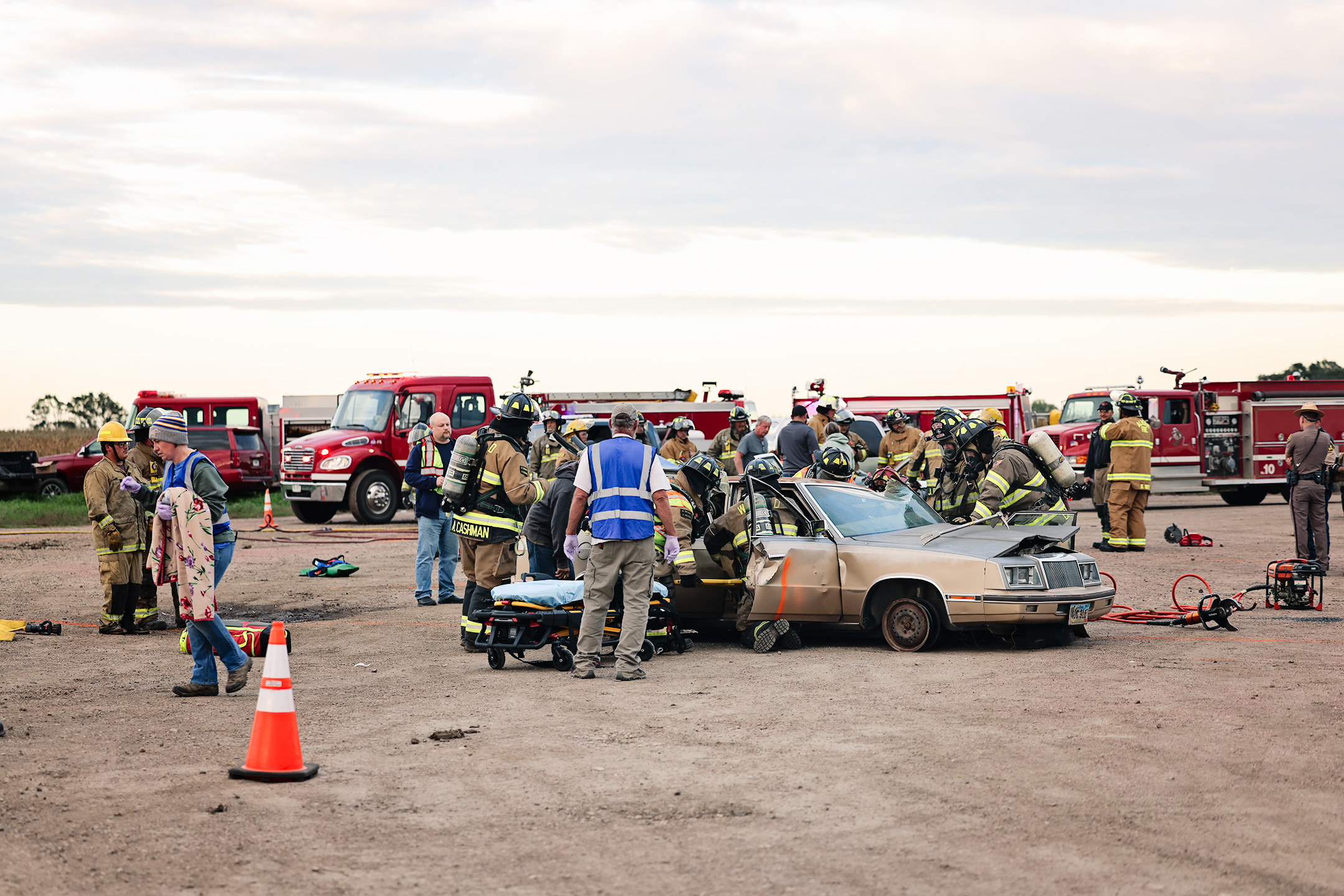 Emergency responders work through a simulated three-vehicle crash during a multi-department mass casualty drill Oct. 1 near the Highway 34 and 281 junction. The exercise brought together area fire departments, ambulance services, law enforcement, hospital and nursing home staff and dispatchers to practice coordinating their response to a complex emergency. (KRISTI HINE / TRUE DAKOTAN)