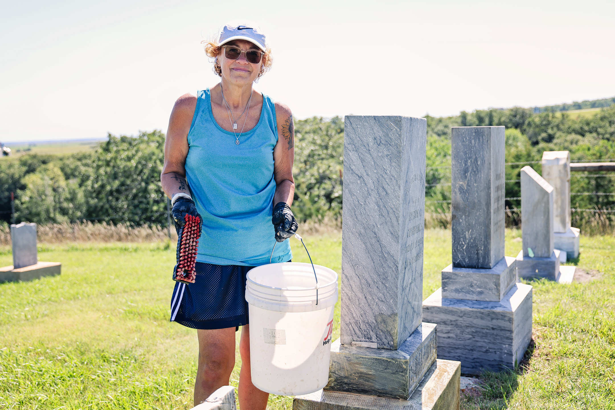 Sandy Jones carefully scrubs years of moss and lichen from a headstone at Prospect Hill Cemetery in Wessington Springs. Jones began cleaning the cemetery’s aging markers last summer and has devoted more than 40 hours to the volunteer project this year.