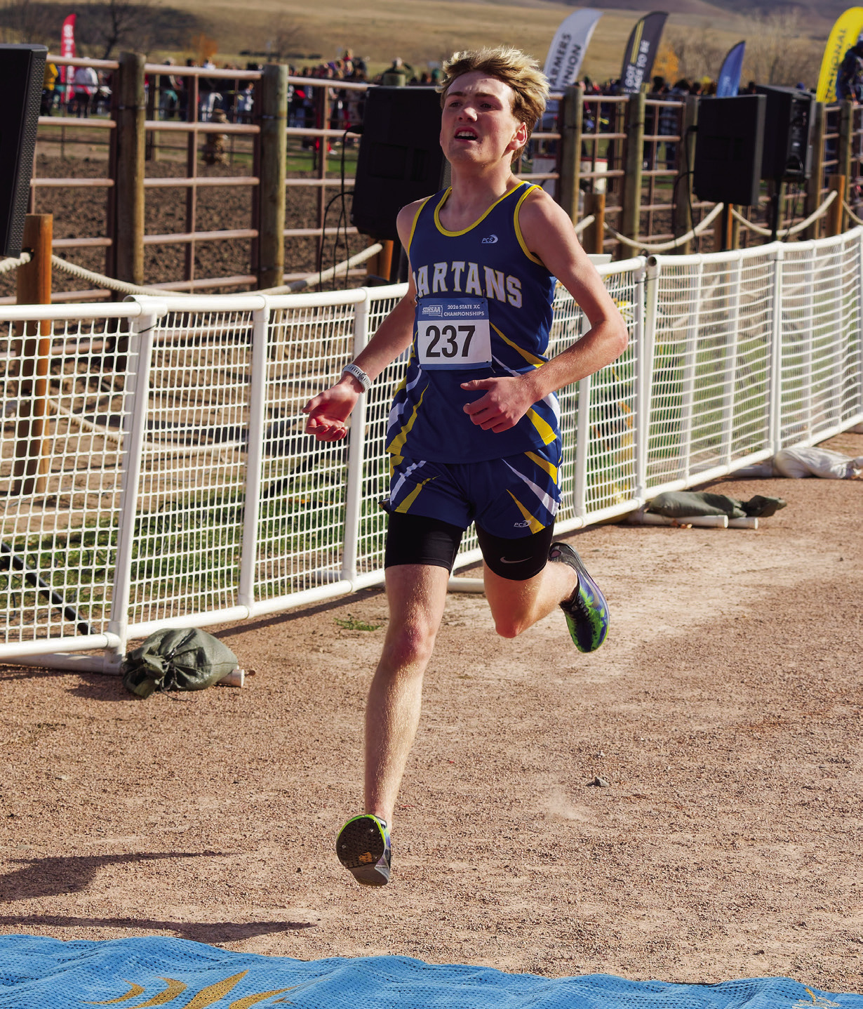 With determination etched across his face, Wessington Springs’ Carson Clements crosses the finish line at the South Dakota Class B State Cross Country Championships on Saturday, Oct. 24, at Hart Ranch Camping Resort near Rapid City. Clements placed fourth among 125 runners, clocking a personal-best time of 16 minutes, 33.3 seconds in the 5-kilometer race. (PHOTO COURTESY SDPB)