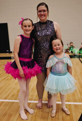 Area dancers Raelynn Waters (left), Mercedes Jones and Lorelei Polly pose backstage during their recent ballet performances with Core Kinetics Dance Studio. Waters completed her first year in the program, Polly finished her second year, and Mercedes graduated after 14 years.