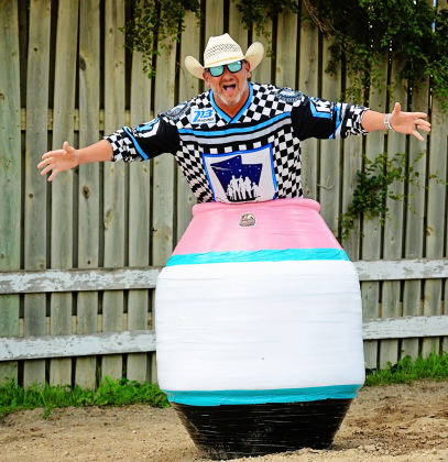 Wessington Springs native Tom Glanzer, better known in the arena as “Tumbleweed Tommy G,” climbs into his custom barrel as he prepares to make his rodeo clown debut during this week’s Foothills Rodeo. The former bull rider says the role combines a lifetime around rodeo with years spent entertaining audiences through television and public speaking. (PHOTO COURTESY TOM GLANZER )