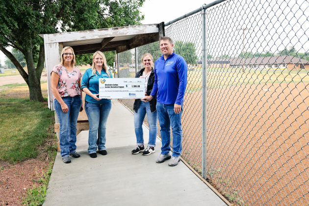 The Wessington Springs Summer Recreation Program was awarded $1,100 to help pay for concrete sidewalks and dugouts. Pictured from left to right: Operation Round-Up Trustee Amber Kolousek, Central Electric Manager of Communications Tara Miller, W.S. Summer Recreation Program Committee Members Natasha Waters and Ryan Jensen.