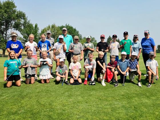Young golfers gather at Springs Country Club during the July Youth Golf Clinic organized by Gloria Vavra and Becky Thompson. The summer program gave participants an opportunity to build their golf skills while learning course etiquette and sportsmanship. 