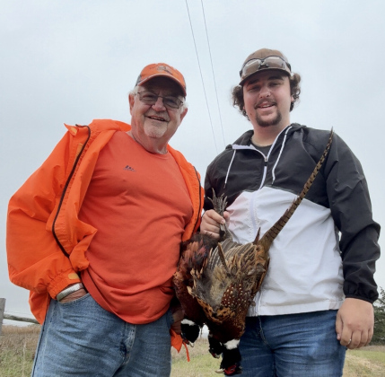 Craig and Layne Wenzel stopped to take a picture during their first grandfather/grandson hunt last year. They both agreed they will do it again this season. PHOTO/CRAIG WENZEL