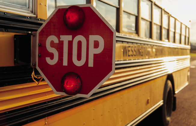 A school bus stop arm serves as an important reminder for motorists as students return to school. Drivers must stop when a bus has its red lights flashing and stop arm extended and remain stopped until the warning signals are turned off. (TRUE DAKOTAN FILE PHOTO)