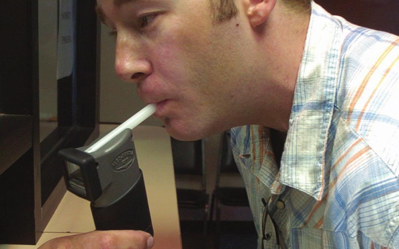 David Whitesock, shown in this 2006 photo taking a breathalyzer test, was tested twice a day for 947 days after receiving his fifth DUI. He now runs his own business assisting in addiction recovery. PHOTO: COURTESY OF ARGUS LEADER