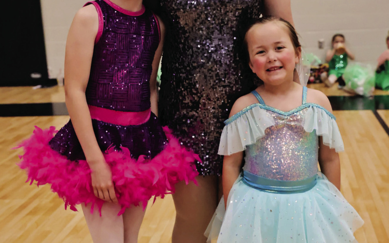 Area dancers Raelynn Waters (left), Mercedes Jones and Lorelei Polly pose backstage during their recent ballet performances with Core Kinetics Dance Studio. Waters completed her first year in the program, Polly finished her second year, and Mercedes graduated after 14 years.