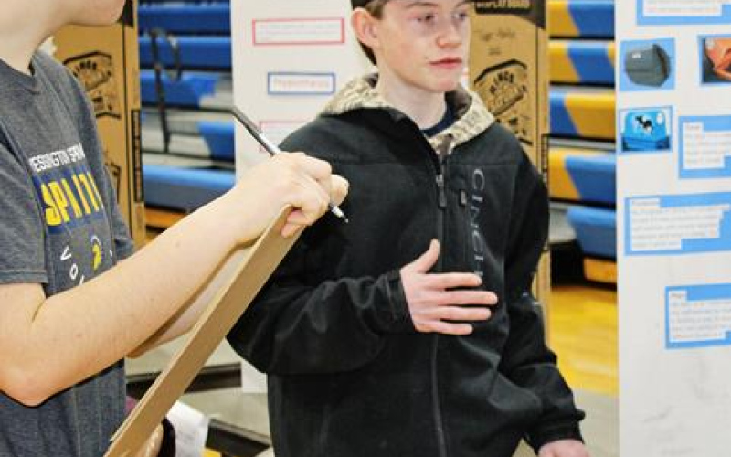 kordell Schafer explaining his project to Sarah Poncelow.