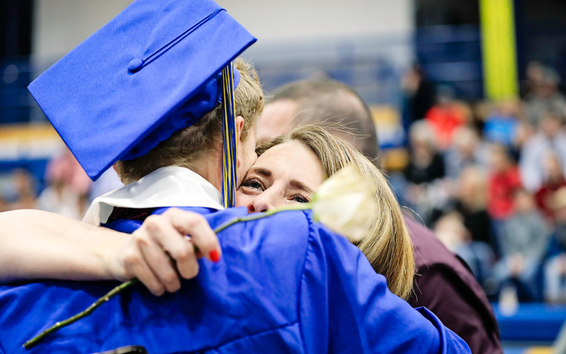Anthony Neely along with his fellow classmates presented roses to parents, family and friends during the ceremony. He is shown presenting a rose and a hug to his mom, Lynn Neely.