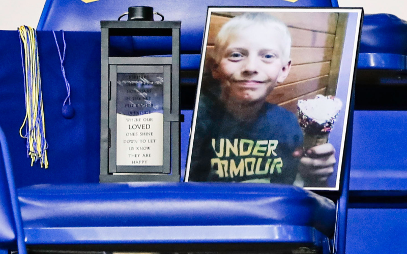 A chair was reserved among the graduates in memory of classmate Jacob Kolousek who passed away on July 24, 2015. Bryce Kopfmann delivered a moving introduction to an emotional presentation for Jacob’s family, in which each graduate presented a rose to Jacob’s parents, also greeting his siblings and grandparents.