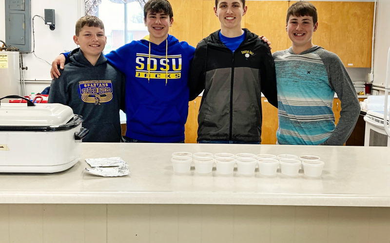 VFW baseball players Wesley Molnar, Blake Miller, Brock Krueger and Brett Miller helped serve the crowd at a recent VFW teener baseball benefit. DELIA ATKINSON / TRUE DAKOTAN