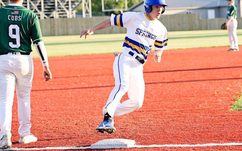Dylan Schimke rounds third and heads for home at last week’s season opener.