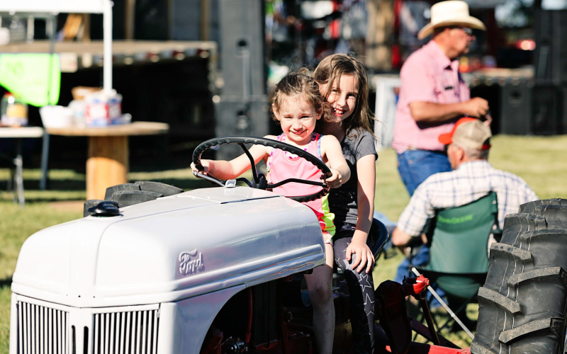 Devin and Britton Van Dyke play on their family’s fifth generation 1949 Ford 8N purchased new in Wessington Springs decades ago.