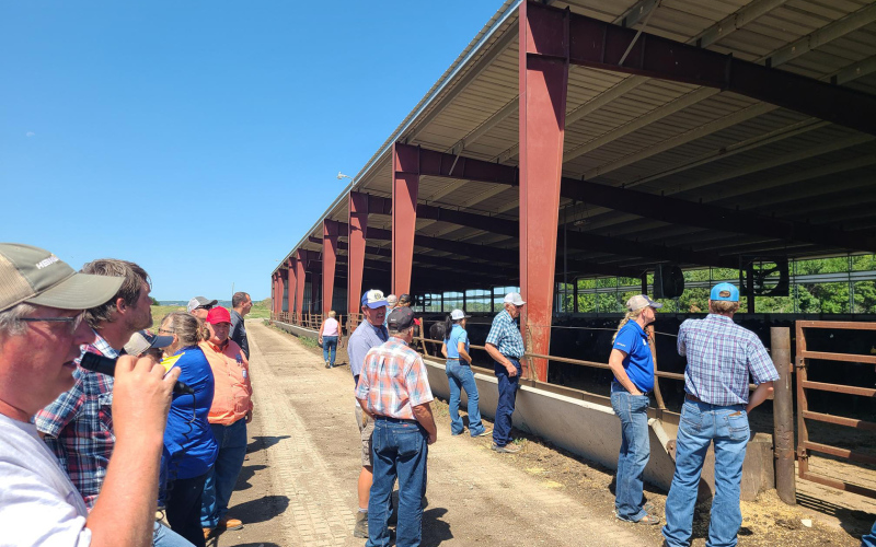 During last week’s feedlot tour coordinated by Warren Rusche, SDSU Extension Beef Feedlot Management Specialist, in collaboration with the South Dakota Cattle Feeders Council, an affiliate of the South Dakota Cattlemen’s Association, Firesteel Ranch owners Jeff Burg (above) and Cory Burg explained different management practices they employ in order to optimize performance on their Wessington Springs feedlot.