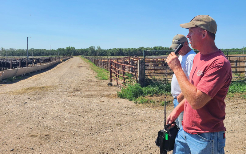 During last week’s feedlot tour coordinated by Warren Rusche, SDSU Extension Beef Feedlot Management Specialist, in collaboration with the South Dakota Cattle Feeders Council, an affiliate of the South Dakota Cattlemen’s Association, Firesteel Ranch owners Jeff Burg and Cory Burg (above explained different management practices they employ in order to optimize performance on their Wessington Springs feedlot.