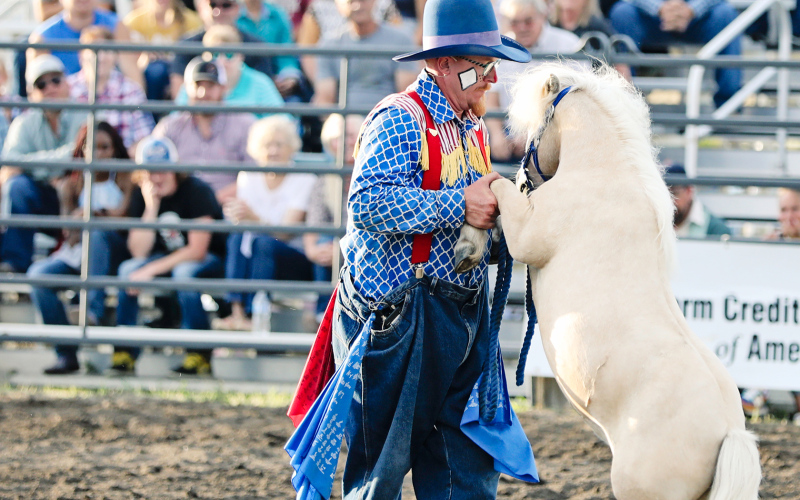 Rodeo clown Jesse Larson took to two stepping in the arena with one of his miniature horses.