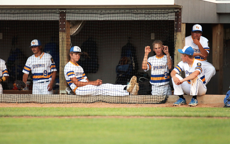 Post 14 players try to stay cool in the dugout. Shown left to right are: Clay Olinger, Kade Olinger, Blake Larson, Dylan Schimke and Tyler Fastnacht.
