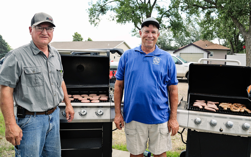 Longtime local volunteer firemen Dick Powell and Kim Schultz grilled brats and burgers from 6 - 9 p.m.