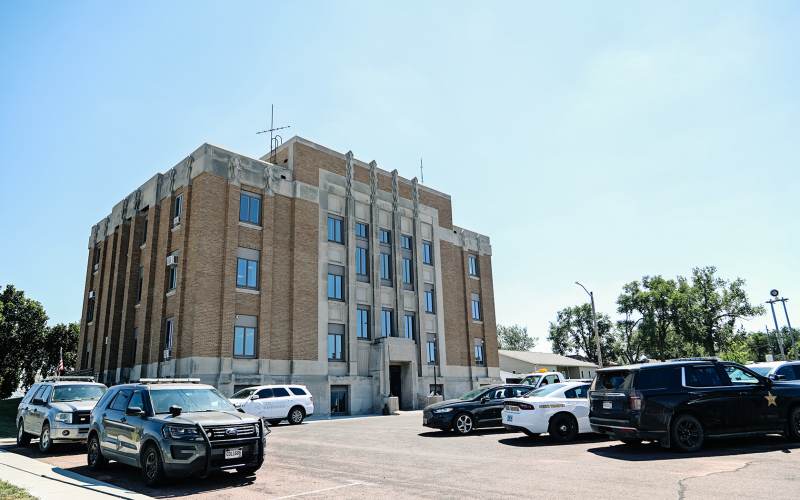 Law enforcement vehicles from multiple agencies were parked at the Jerauld County Courthouse August 17 for the sentencing of Mitch Caffee.