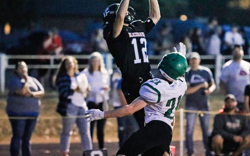 Blake Larson (12) reaches up to catch a reception that resulted in a touchdown.