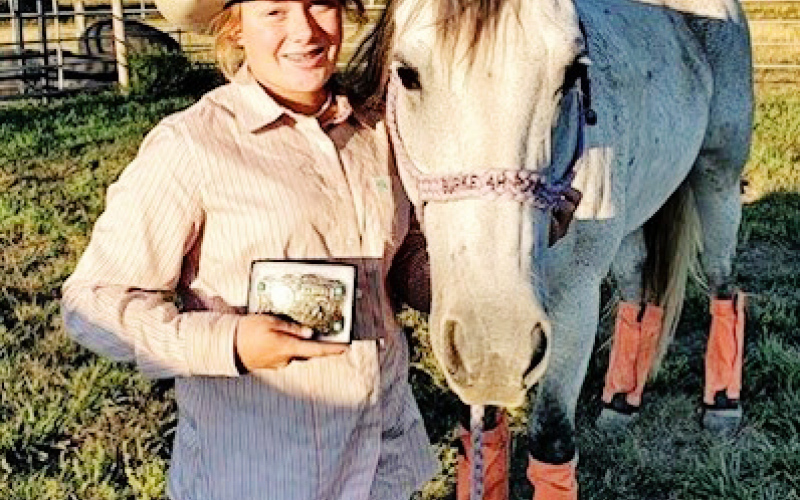 Ella Fagerhaug is shown holding the buckle she won for Junior Girls Reserve Champion Barrel Racer. She earned 4th All-Around for her performances in Barrels , Poles, Goat Tying, Break Away and Flag Racing.