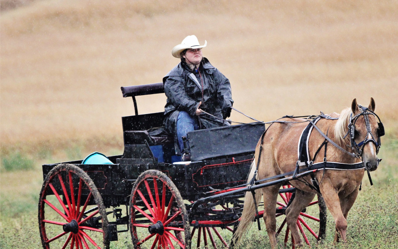 Determined to drive, Katelin Deneke didn’t let the damp weather stop her from continuing on her father Steve’s annual tradition. PHOTO COURTESY DARRELL DENEKE