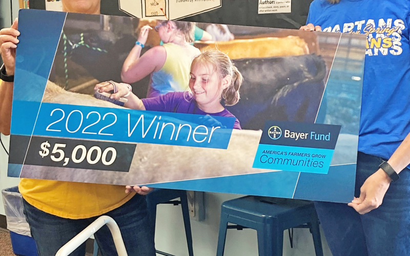 Tricia Messmer  (left) recently directed a $5,000 Bayer Fund America’s Farmers Grow Communities donation to the Blue Bag Program. She is shown with Blue Bag volunteer Carmen Weber.