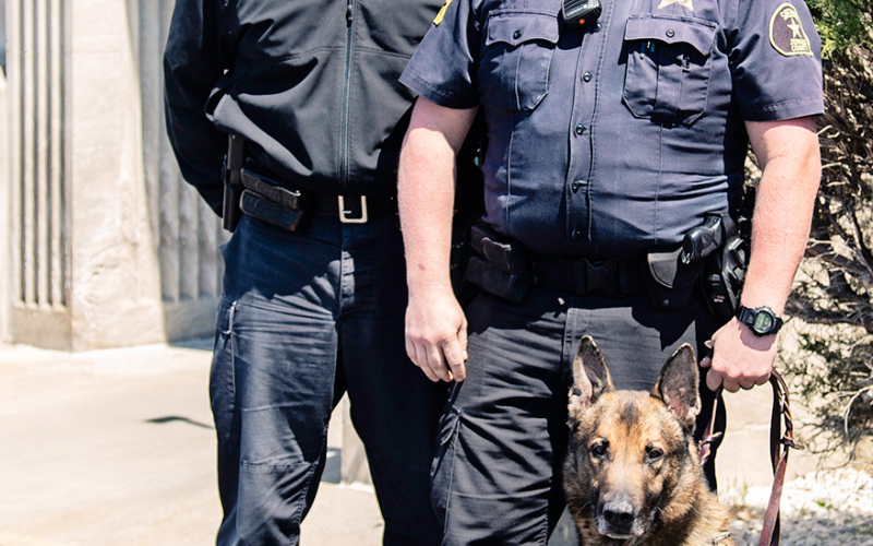 TRUE DAKOTAN FILE PHOTO  Shown left to right are Jerauld County Sheriff’s Deputies Mike Krueger, Paul Sheldon and Police Service Dog Mack. The trio were among law enforcement who took part in the apprehension of suspects involved in a high speed chase early Saturday morning, September 10, throughout Beadle and Jerauld Counties.
