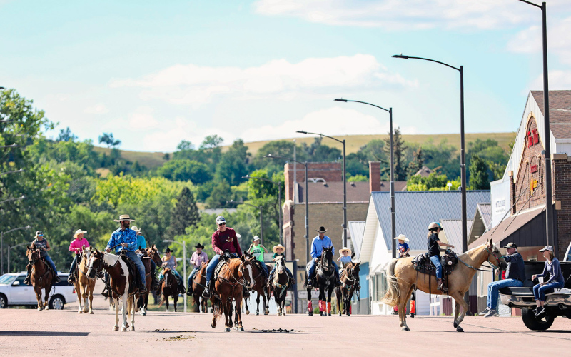 Riders take a stroll down Main Street before making their way past the Weskota Manor and back to the rodeo grounds to end their fun weekend of festivities. KRISTI HINE / TRUE DAKOTAN