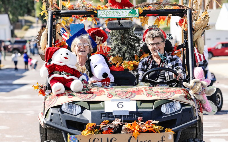The Class of 1970 won third prize in that same category, with Joyce (Knutson) Piehl (left) and Joyce (Keeton) Krueger wishing the crowd happy (every) holiday.