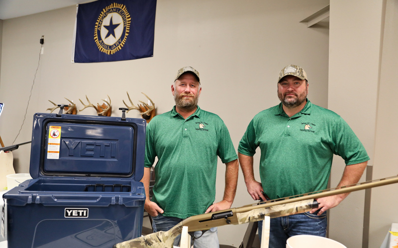 Ducks Unlimited members Brian Kolousek and Scott Miller sold chances to win a Yeti cooler and a gun.