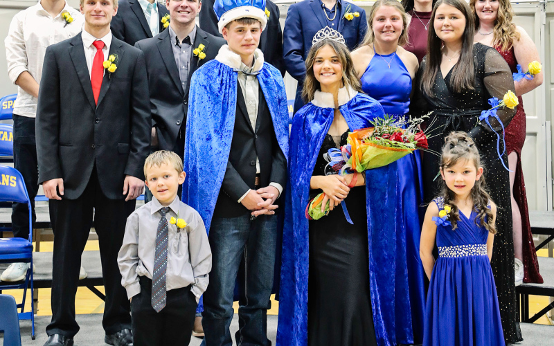 The royal court stand together at coronation shortly after the crowning of King Austin Schimke and Queen Kate Havlik. Shown back row left to right: Joao Vitor De Faria Tavares Reis, Colton Michalek, Cayden Forrest, Jack Neely, Sarah Poncelow, Riley Roduner. Middle row: Braydin La Bore, Carson Hainy, Kirstie Munsen, Harlee Heim. Coronation ring bearers are Kash Woodin and Blaire Murphy.