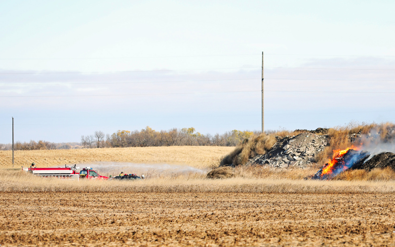 KRISTI HINE / TRUE DAKOTAN Wessington Springs Volunteer Fire Department is shown attempting to contain a persistent fire at the City of Wessington Springs restricted rubble site Monday morning.