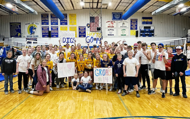 Fellow players, fans and family members joined Alyssa Grohs for a celebratory photo to commemorate reaching the 1000-dig milestone last Tuesday on October 25. Grohs reached the milestone during a home victory against Hitchcock-Tulare.
