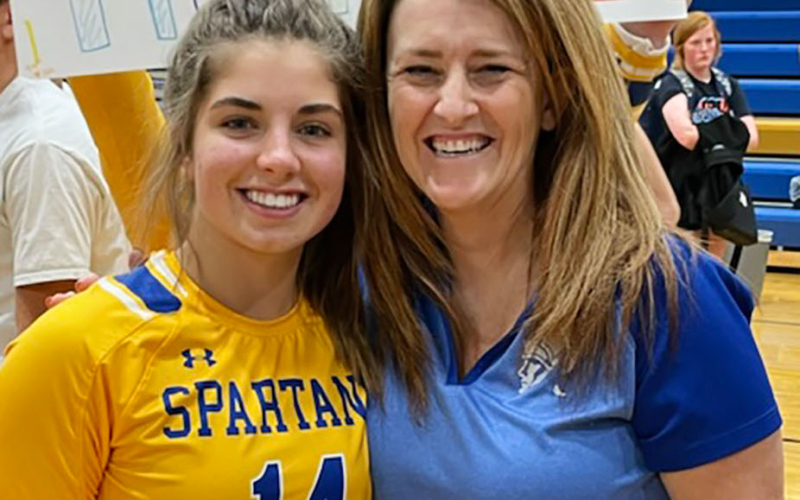 On the heels of reaching the 1000-assist milestone in October of 2021 at home, the high school junior (pictured with Head Volleyball Coach Lynn Neely) said she is happy to achieve the 1000-dig goal she set last season in front of a home crowd once again.