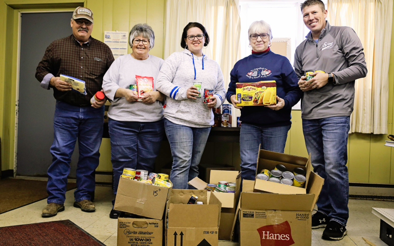Shown above left to right are: Food Pantry volunteers Darwin and Kay Reindl, Laura Baker of Baker’s Design, Food Pantry volunteer Marcella Andersen and Ryan Jensen of Springs Food Market.