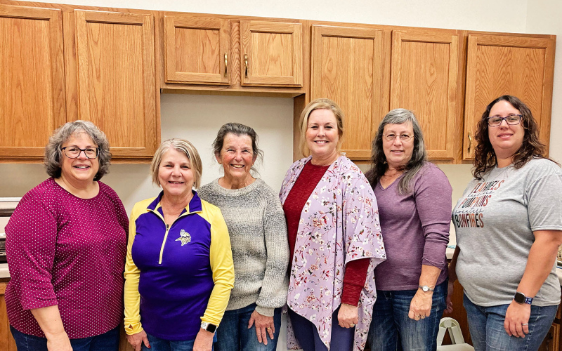 Event volunteers are shown left to right: Lisa Edwards, Patsy Sorben, Jean Ferguson, Melissa Schimke, Brenda and Andrea Freidrickson.
