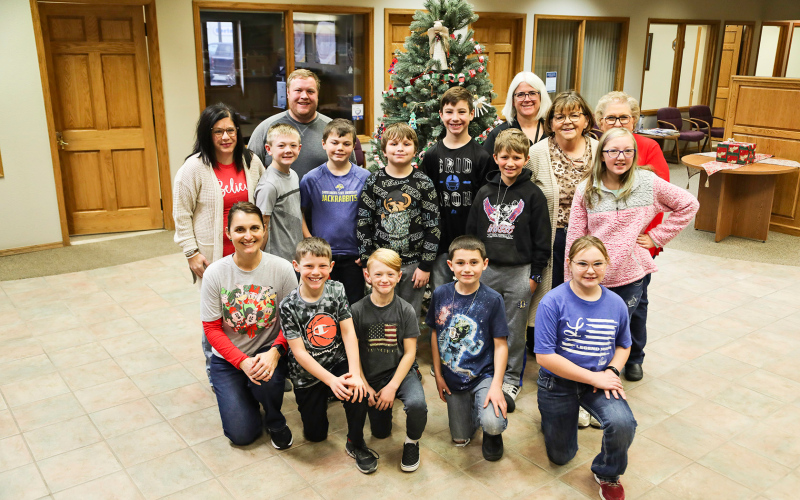 Back row, left to right: American Bank and Trust employees Blake Willman, Melanie Schelske and Connie Larson. Middle row left to right: Lisa Bergeleen, 4th Grade Teacher, Casen Waters, Chase Wenzel, Zeelan Beyer, Keaton Hasty, Jace Kolousek, Sue Schelske, Paraprofessional, Kylie Edwards. Front row, left to right: Becky Krueger, Title/Sped Teacher, Ethan Heumiller, Brody Thompson, Lorin Schaller Josie Arhart.