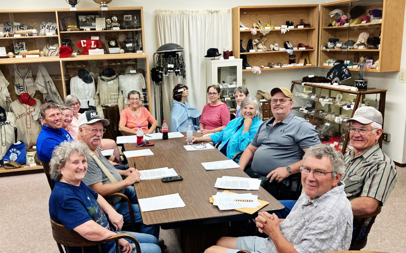 Pictured clockwise from lower left during the final building swap meeting are Patti Diedrich, Darrell Deneke, Ryan Jensen, Eileen Woodruff, Sue Hasz, Jean Ferguson, Susan Arnott, Mary Jane Belz, Deb Ponto, Jerry Voorhees, Dennis Scheel and Mark Steichen. PHOTO COURTESY GAIL ARNOTT