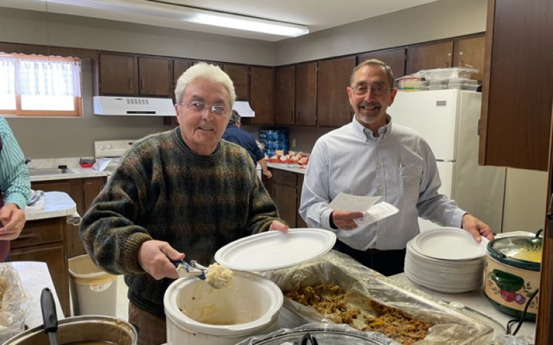Leo Channel and Terry Scheel served up mashed potatoes, gravy, turkey, dressing and all the trimmings of a beautiful Christmas meal.    