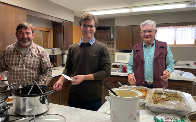 Nantie Bothma, Riann Jansen Van Murren and Dennis Scheel were among the 30 volunteers who helped serve 80 attendees at the “Home Alone” Christmas meal. CENTER: The Hope Fellowship Hall was the venue for this year’s Christmas dinner.