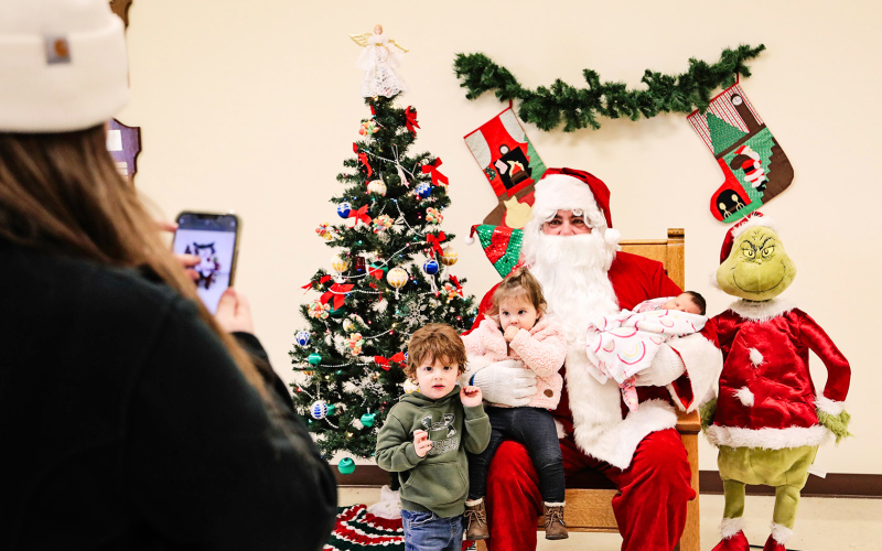 The Wessington Springs Senior Center hosted kids and families for Santa Saturday. Kathy Wetzel is shown in the foreground taking a picture of her and husband Pat’s children Wade, Hannah and Josie with Old Kris Kringle.