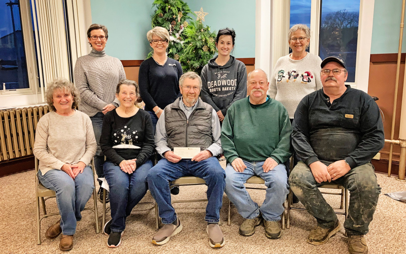 Back row, WSACF board members Gwyneth Dean-Witte Fastnacht, Kari Fagerhaug, Bethany Schimke and Laura Kieser. Front row representing the Dunham Historical Society are Patti Diedrich, Jean Ferguson, Mark Steichen, Darrell Deneke and Jerry Voorhees. CAM FAGERHAUG / TRUE DAKOTAN
