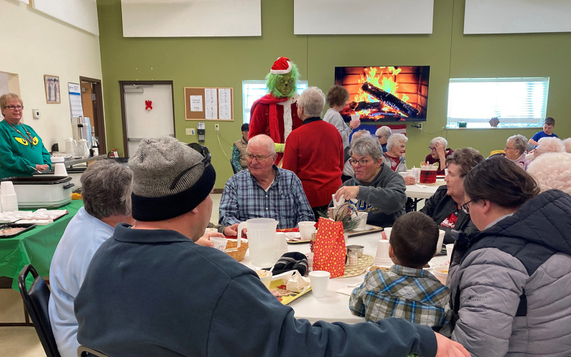 DELIA ATKINSON / TRUE DAKOTAN Santa, the Grinch and friends visited the center on Saturday, December 3 to greet all the children in town and pass out goody bags donated by Sandy and Denny Beckman. A meal was served by the Senior/Community Center during and after Santa’s visit.