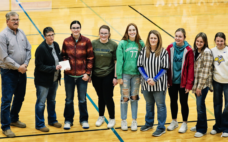 Shown left to right: Weskota Foundation board member Roger Hainy, Weskota Foundation Coordinator Ellen Powell, Lady Spartans volleyball players Sarah Poncelow, Riley Roduner, Caroline Witte, Coach Lynn Nelly, Haeleigh Mulder, Mariah Messmer and Hannah Heezen.