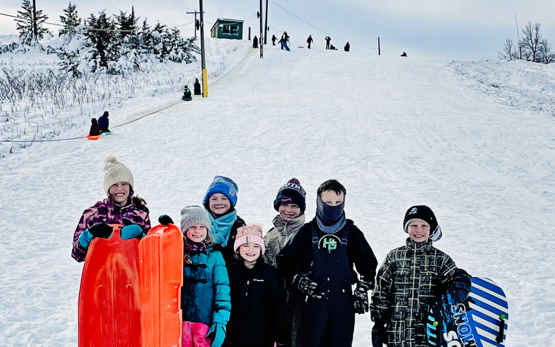 PHOTO COURTESY JEN KOLOUSEK One of the many sledding crews enjoying the hill in Wessington Springs last Tuesday included, left to right: Aunnika Heumiller, Alice Heumiller, Casen Waters, Carlayna Waters, Jace Kolousek, Hastin Heezen and Ethan Heumiller.