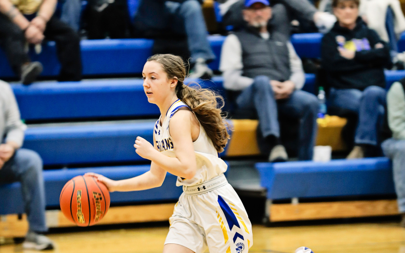 Logan Mohling dribbles down the court. 