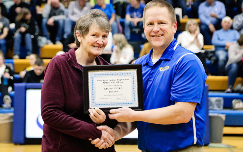 Gloria Vavra, WSHS Class of 1978, was one of the esteemed inductees, shown with WSHS Athletic Director Jason Kolousek